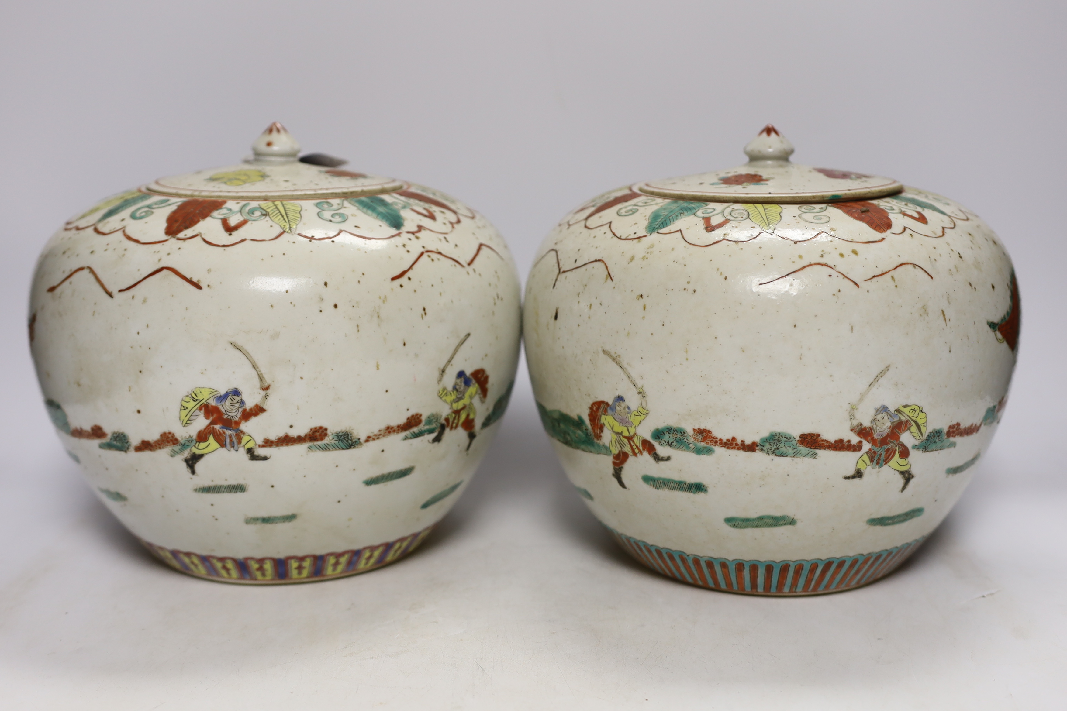 A pair of Chinese famille rose jars and covers